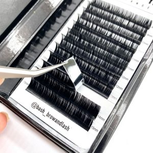 box with classic lashes being picked up with tweezers