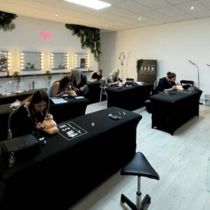 Students in action completing a hybrid lash extension course.