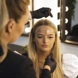 tutor demonstrating brow mapping during a masterclass