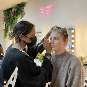 Student working on a model during a brow threading course.