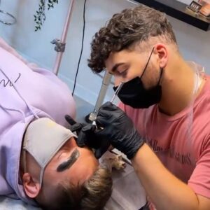 a student working on a model during a nanoblading microblading course